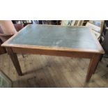 An oak desk, with green writing surface, fitted with a drawer to either end, 54ins x 36ins, height