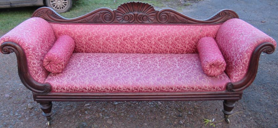 A 19th century mahogany and upholstered settee, with carved back and scroll arms, length 88ins