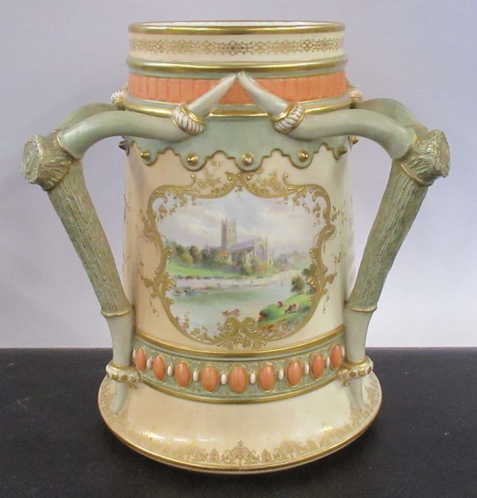 A Royal Worcester presentation trophy, decorated with three panels painted with fruit and a view