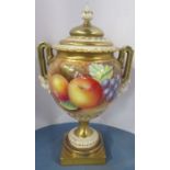 A Royal Worcester covered vase, having twin mask handles, decorated with fruit to a mossy ground