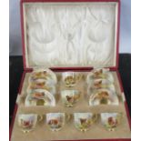 A cased set of Royal Worcester cups and saucers, decorated with Highland cattle in a landscape by
