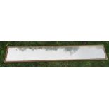 A rectangular wall mirror, overall 69ins x 11.5ins