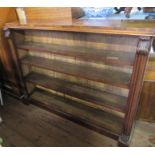 A 19th century mahogany open bookcase, with fixed shelves and carved decoration, 45ins x 58ins,