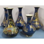 Four Wilton Ware vases, decorated with gilt dragons and buildings to a blue ground, height 9ins,