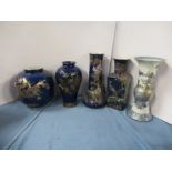 Three Wilton Ware vases, decorated in gilt to a blue ground, together with a Carlton Ware vase,