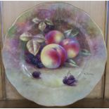 A porcelain plate, decorated with fruit to a mossy background by R Budd, with shaped edge,