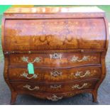 A 19th century Dutch style mahogany and satinwood inlaid bombe bureau, the roll top opening to