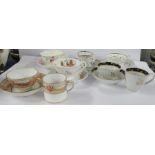 Two 19th century English porcelain trios, comprising coffee can, tea cup and saucer, together with