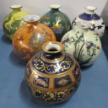 Six Wilton Ware onion shaped vases, all decorated with different patterns, height 5.5ins