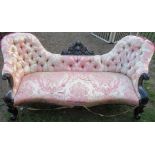 A Victorian double spoon button back settee, with carved decoration to the showwood, length 80ins