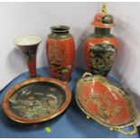 Five pieces of Carlton Ware, all decorated with Oriental landscapes to a black and red ground