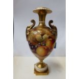 A Royal Worcester vase, decorated all round with fruit, signed D Shinnie, shape number 1969 s/s,