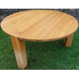 A 20th century circular dining table, raised on three block legs, diameter 62.5ins, height 30ins