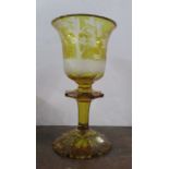 A large 19th century Bohemian amber flashed wheel engraved goblet, finely decorated with four