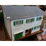 A painted dolls house, with doll house furniture