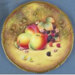 A Royal Worcester plate, painted apples, blackberries, red berries, flowers and Autumn leaves to a