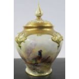 A Royal Worcester covered pot pourri, decorated to the front with pheasants in landscape by Jas