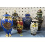 Five Carlton Ware covered vases, two decorated with swallows, two with dragons, together with a