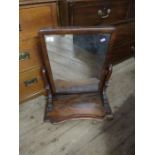 A mahogany framed toilet mirror, plate dimensions 22ins x 15ins