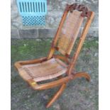A 19th century folding cane seated child's chair or nursing chair