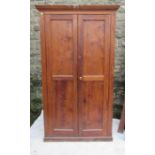 A pine two door cupboard, fitted with shelves, 78ins x 45ins, depth 16.5ins
