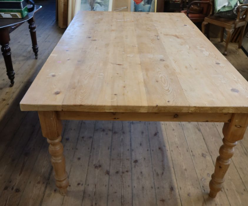 A large pine kitchen table, 50.5ins x 84ins, height 31ins