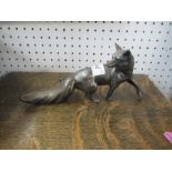 A silver coloured model, of a fox