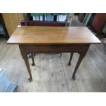 A 19th century mahogany rectangular sidetable, fitted with a frieze drawer, on a pad foot, 35ins x