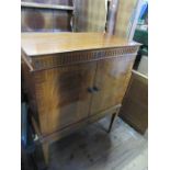 A TV cabinet, width 34ins, height 43ins