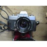 A Minoita SRT101b camera, together with a Canon motor zoom 8 camera, lens etc