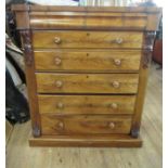 A large Victorian mahogany chest, of a secret frieze drawer over five long graduated drawers, with