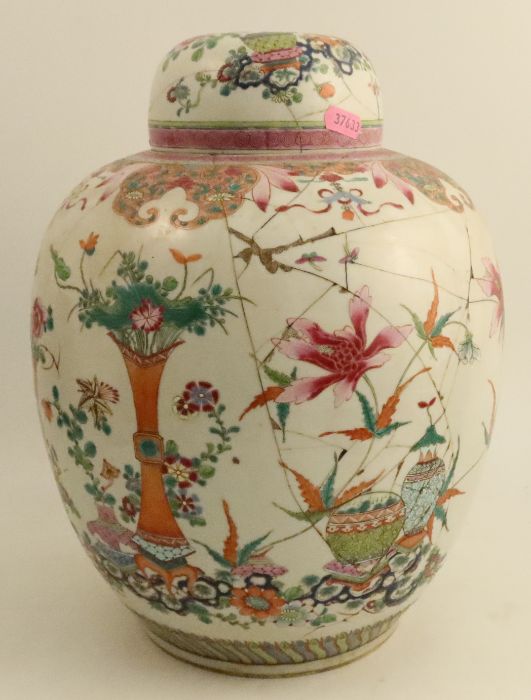 An early 19th century Chinese famille rose ginger jar and cover, decorated with lotus and precious