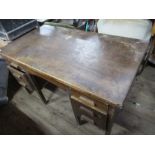 An oak desk, width 54ins, depth 30ins, height 31ins