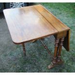 A 19th century rosewood Sutherland table, on turned legs, 40.5ins x 30ins, height 29ins