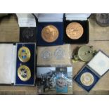 A collection of Military items, to include a Churchill medal, cap badges, compass etc