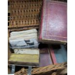 A basket containing various books, bibles and postcards