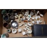 A box of assorted china to include crested ware and slipware