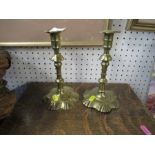 A pair of Antique brass candlesticks