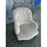 A 19th century upholstered nursing chair, with button back
