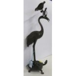 An Oriental metal model of a stork,