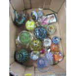 A collection of glass paperweights