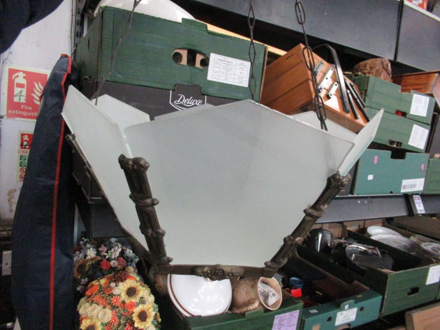 An Art Deco hexagonal brass ceiling light, having frosted glass panels with original suspension