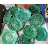 A collection of green leaf plates, most being 19th century and some marked Wedgwood