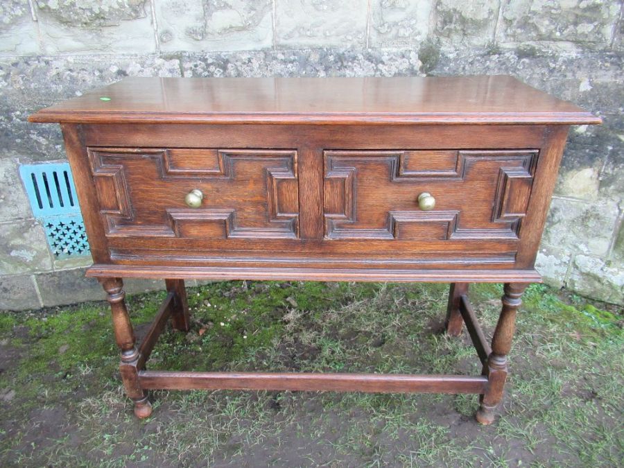 An oak sideboard, with moulded decoration width 42ins , depth 18ins height 33ins