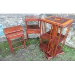 A mahogany revolving book stand, together with a nest of tables and a bedside two tier table