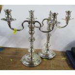 A pair of silver candelabra, with two branches, on a knopped stem, London 1958