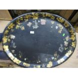 A large papier mache tray, wit gilded and mother of pearl decoration