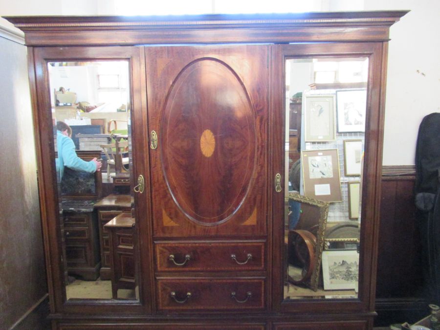 An Edwardian mirror door compactum , width 73ins, depth 19ins, height 80ins