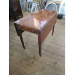 A 19th century mahogany Pembroke table, with drop flaps and fitted with one real and one dummy