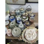 A collection of Carlton Ware biscuit barrels, tobacco jars, coffee pots etc